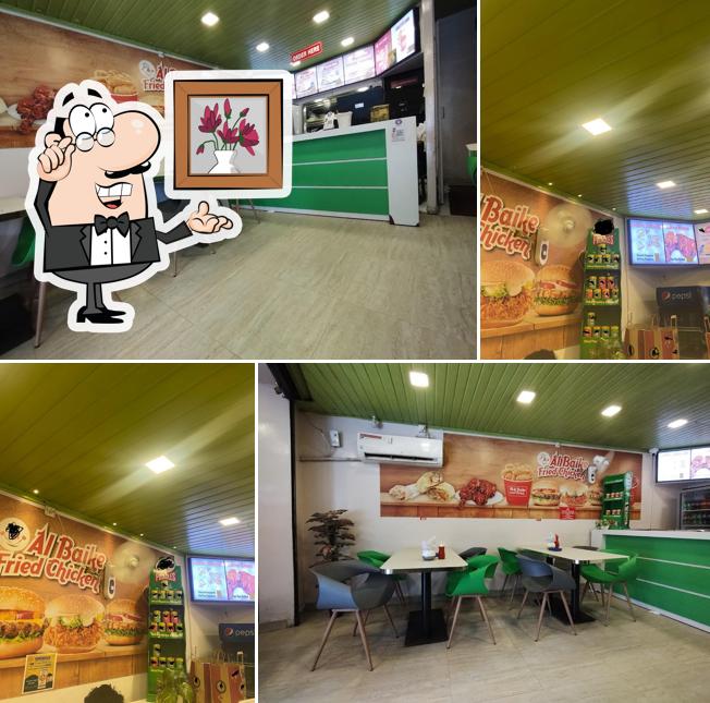 Take a seat at one of the tables at Al Baike Broasted Chicken