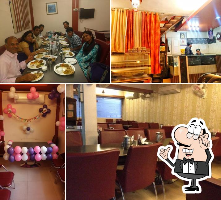Take a seat at one of the tables at Sagar Restaurant
