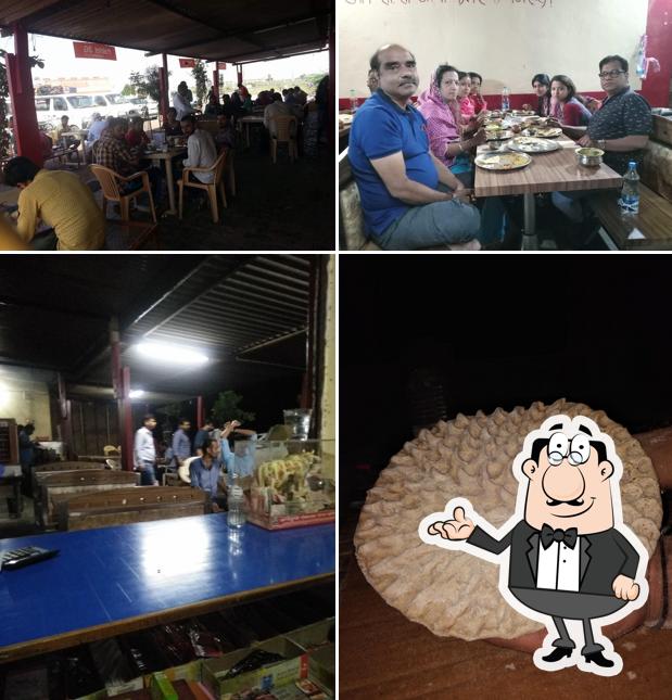 Take a seat at one of the tables at Maxx Shiv Kripa Restaurent