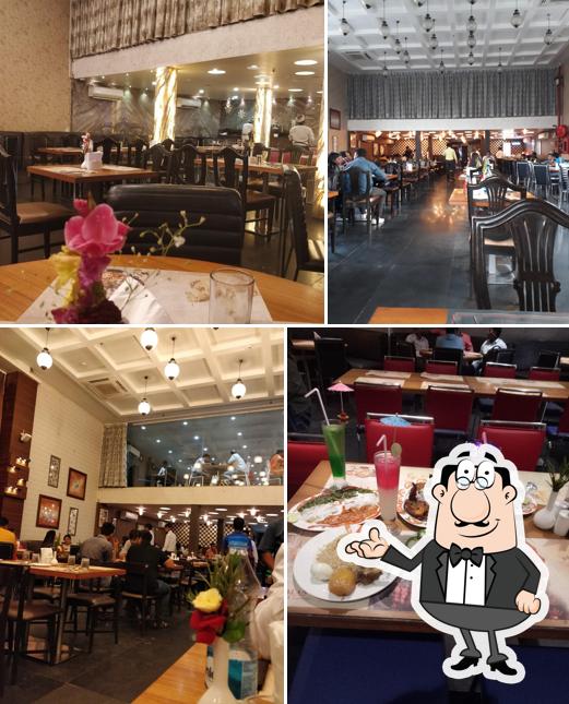 Take a seat at one of the tables at Arsalan Restaurant & Caterer