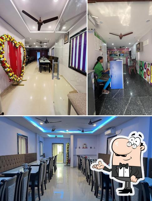 Take a seat at one of the tables at Kukku Restaurant