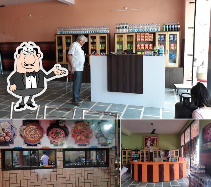 Take a seat at one of the tables at Milan Dhaba Family Restaurant Pure Veg