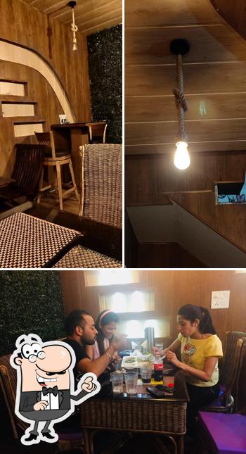 This is the picture showing interior and dining table at The Chaat Studio
