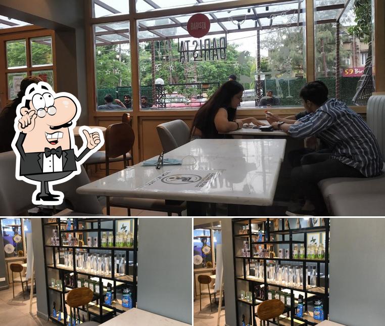Take a seat at one of the tables at Barista