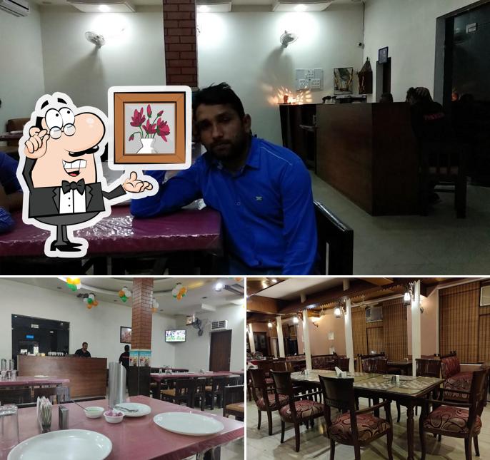 Take a seat at one of the tables at PAKWAAN RESTAURANT