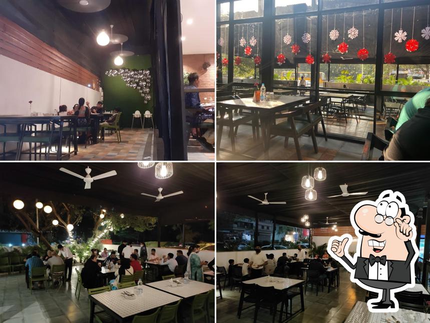 Take a seat at one of the tables at Yalla Yalla