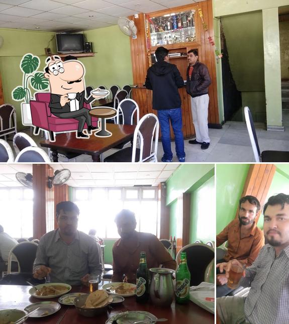 Take a seat at one of the tables at Jagan Cafe