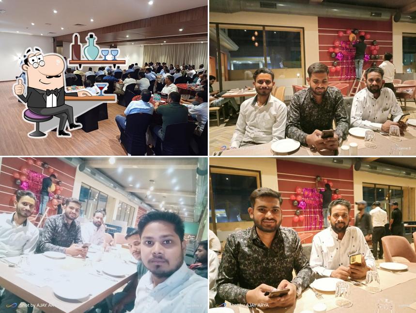 Take a seat at one of the tables at Clubhouse Hotel Morbi