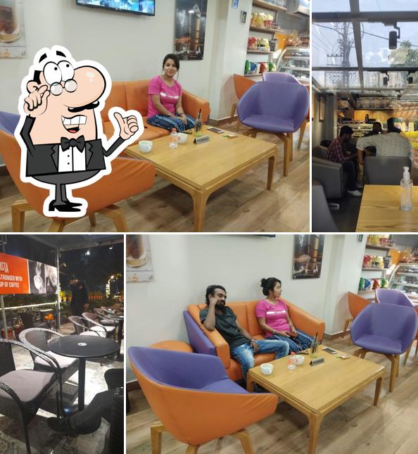 Take a seat at one of the tables at Barista