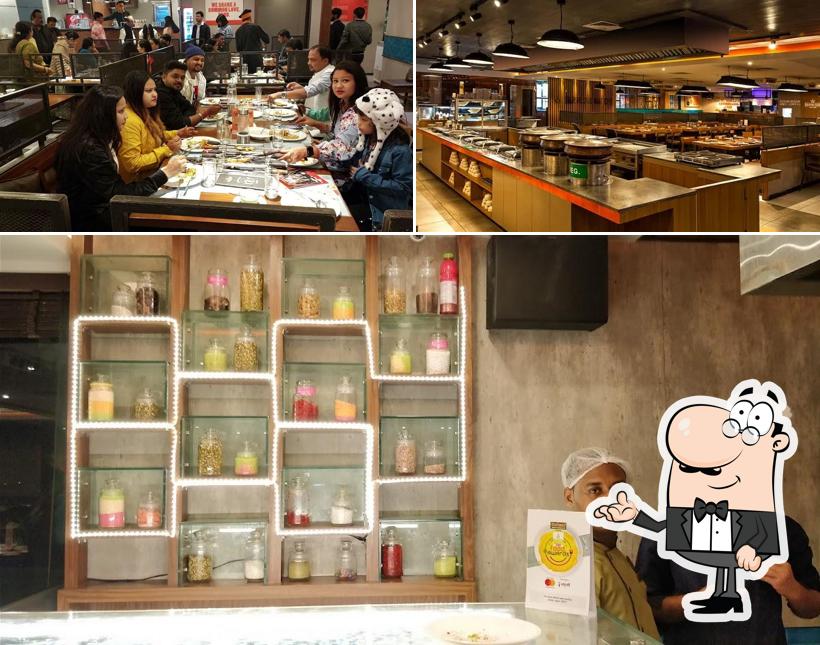 Take a seat at one of the tables at Barbeque Nation