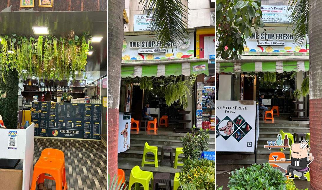 Take a seat at one of the tables at ONE STOP FRESH CAFE