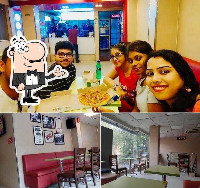 Take a seat at one of the tables at Domino's Pizza Kotrung, Uttarpara Take a seat at one of the tables at Domino's Pizza Kotrung, Uttarpara