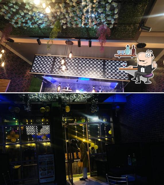 Take a seat at one of the tables at GANG TARANG Cafe &Restro