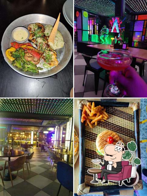 Take a seat at one of the tables at JOSH-THE HIGH ENERGY BAR