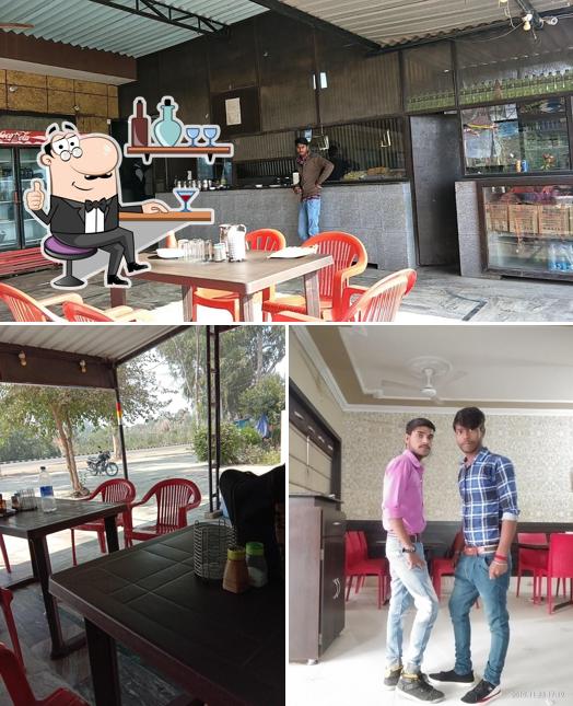 Take a seat at one of the tables at New GK Food Point