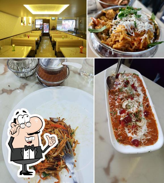 Take a seat at one of the tables at Satkar Veg Restaurant