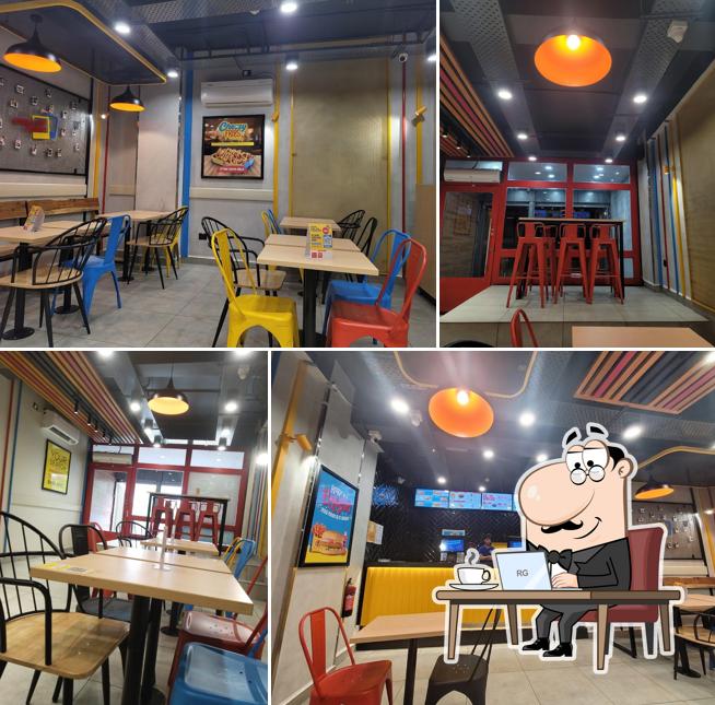 Take a seat at one of the tables at Burger Singh