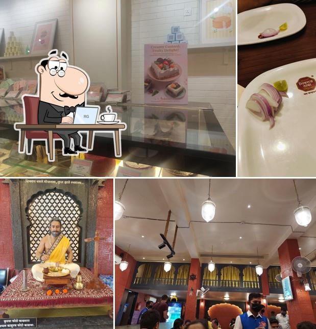 Take a seat at one of the tables at Hotel Shivraj Dhaba Karad Belapur