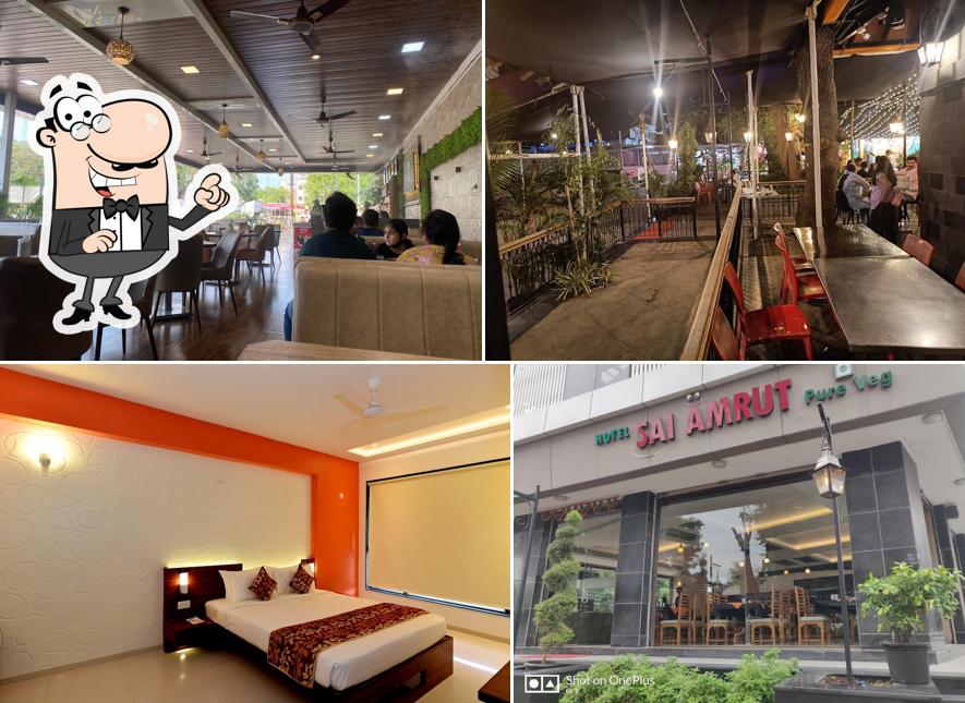 Take a seat at one of the tables at Hotel Sai Amrut