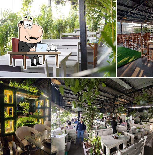 Take a seat at one of the tables at Oyster, Bar & Kitchen
