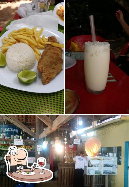 Dê uma olhada a ilustração mostrando comida e interior no Bar do Nelson - Ilha do Cedro