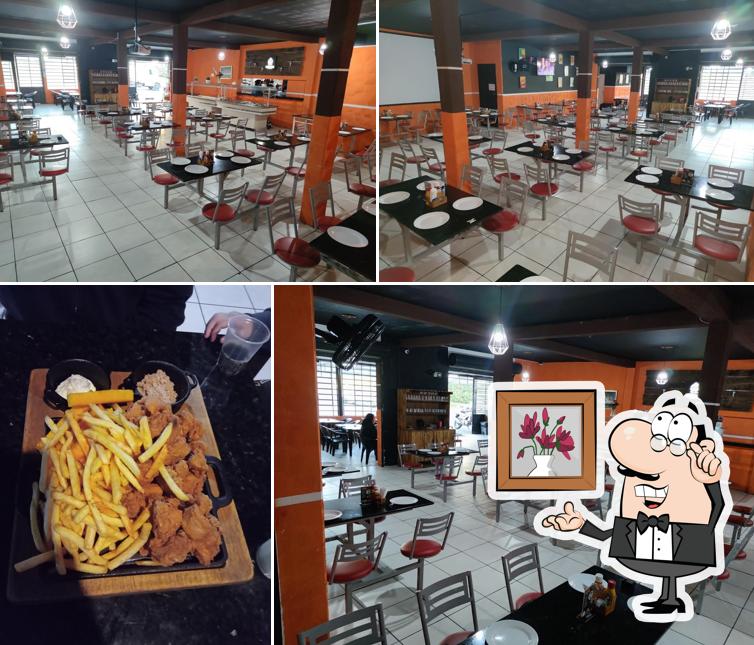 Sente em uma das mesas no Pizzaria do Gerson