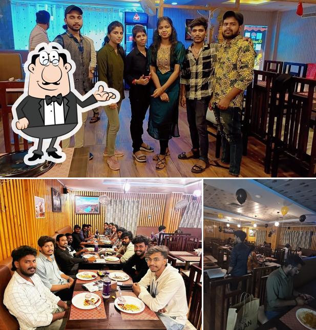 Take a seat at one of the tables at Rayalaseema Spice Restaurant