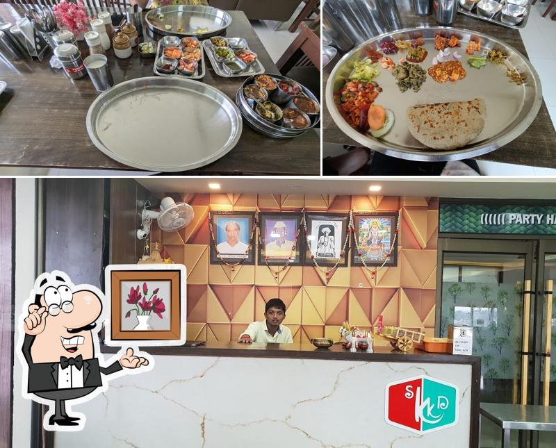 Take a seat at one of the tables at Khodiyar Kathiyavadi Dhaba
