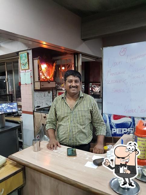 Take a seat at one of the tables at Vaibhav Restaurant