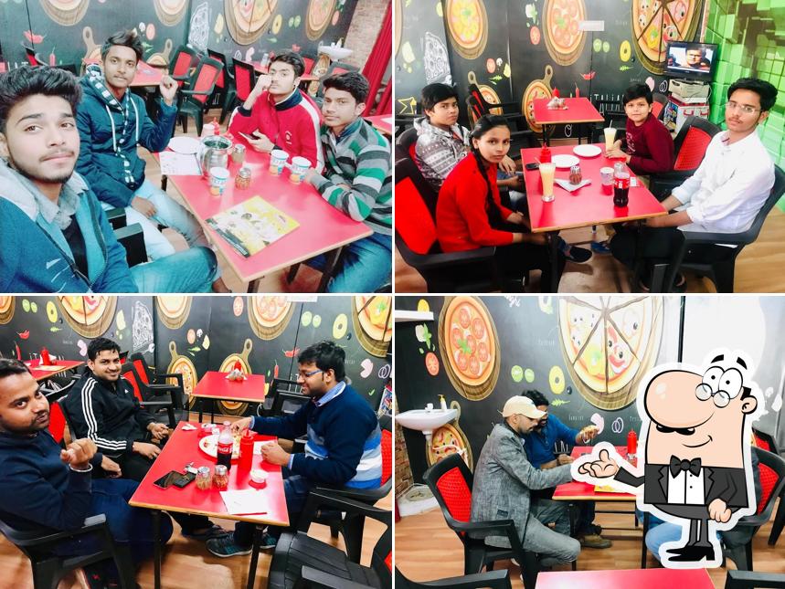 Take a seat at one of the tables at Go69 Pizza Gorakhpur