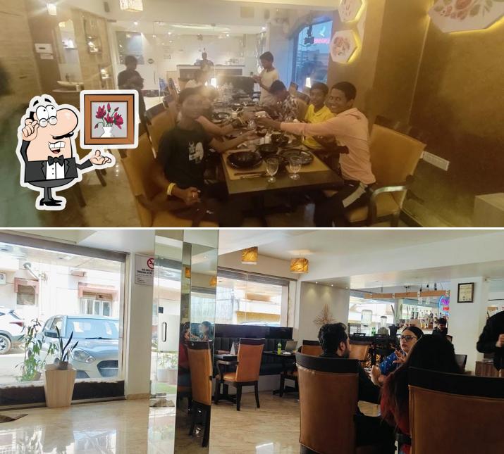 Check out the image displaying interior and food at Miri Global Fusion Dining Miramar, Panjim