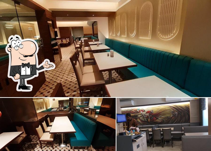 Take a seat at one of the tables at Ashok Veg