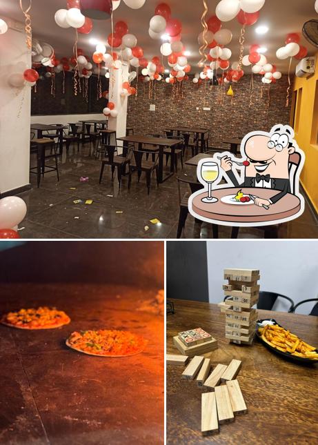 Take a look at the picture depicting food and interior at PIZZA CRAVINGS (WOOD FIRED BRICK OVEN PIZZERIA)