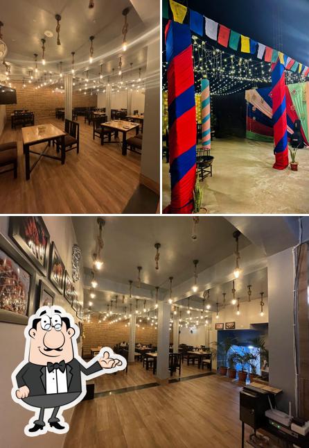 Take a seat at one of the tables at Shyam Restro and Cafe