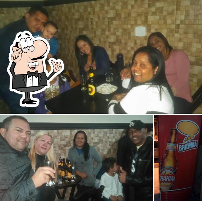 Esta é a foto mostrando interior e comida no Espetaria&Choperia Nossa Gente