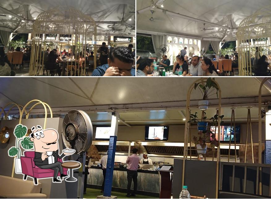 This is the image displaying interior and beverage at Veggies - Veg Fast Food Restaurant