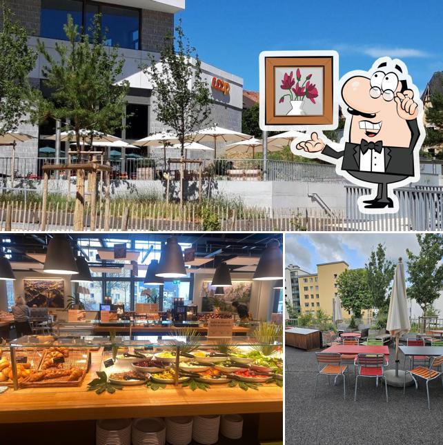 La foto di interni e cibo da Coop Restaurant Delémont Le Ticle