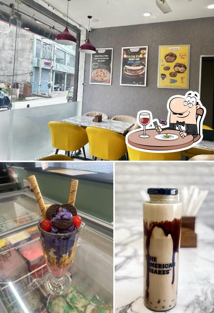 The photo of food and interior at The American Shakes