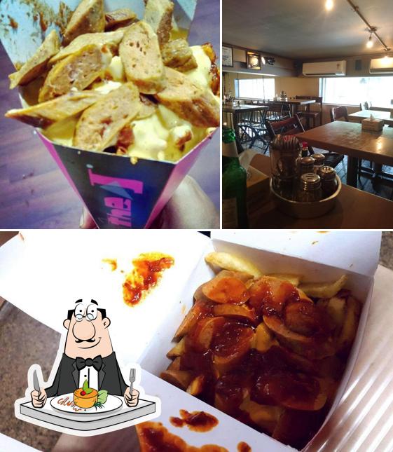 This is the picture displaying food and dining table at The J
