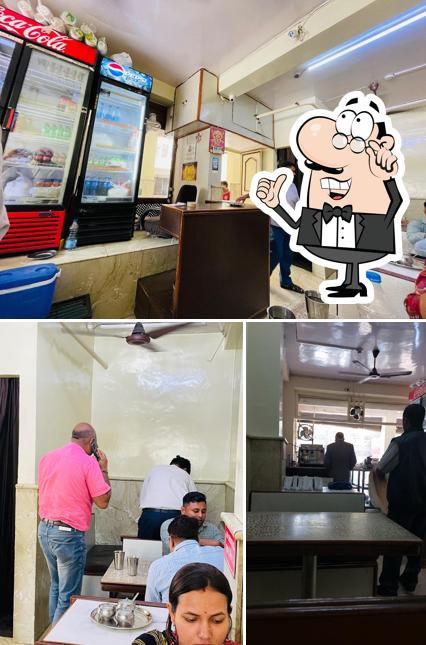 Check out the image displaying interior and beverage at Raja Snacks Bar