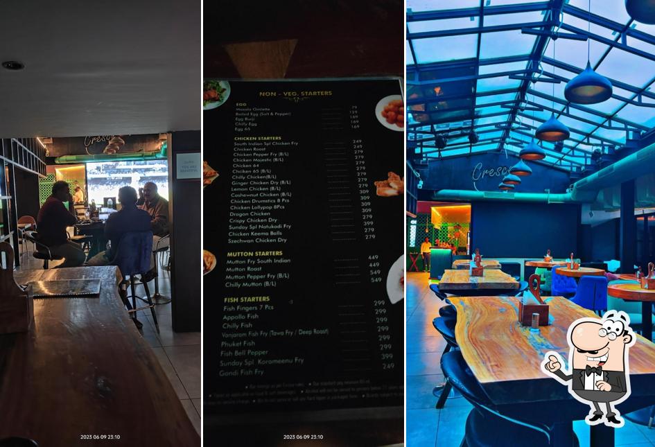 Take a seat at one of the tables at Crescent Resto Bar