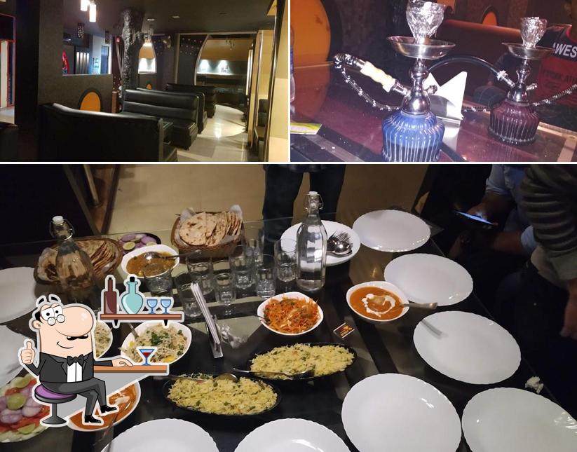Take a seat at one of the tables at Kazuza Restaurant