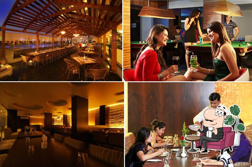Take a seat at one of the tables at Le Royale Pune