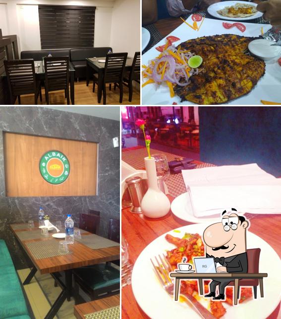 Take a seat at one of the tables at Albaik Family Restaurant