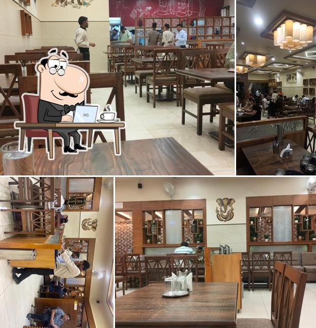 Take a seat at one of the tables at Hotel Shabari