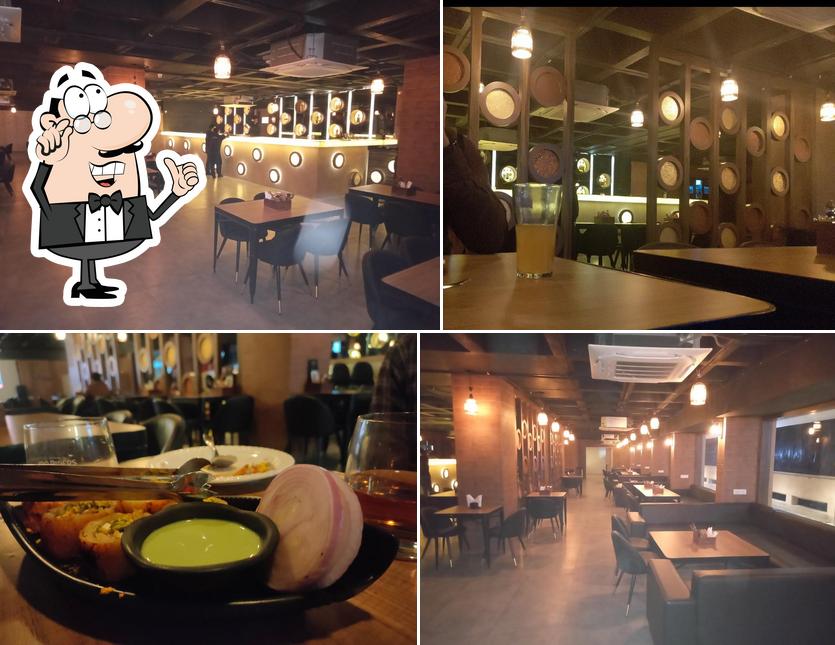 Take a seat at one of the tables at Only Bar Restaurant