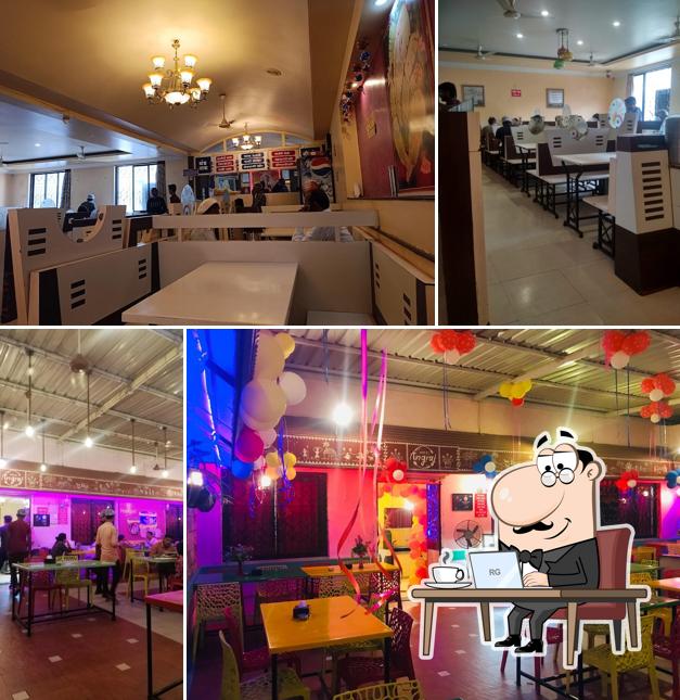 Take a seat at one of the tables at Hotel Angraj