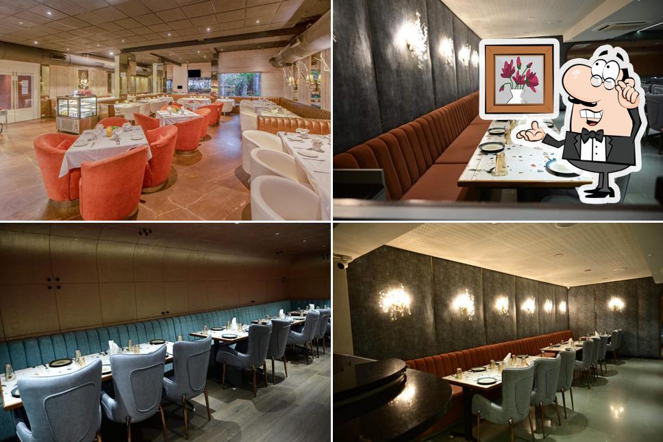 Take a seat at one of the tables at ACP EXPRESS RESTAURANT & BAR BY AIRPORT CENTRE POINT