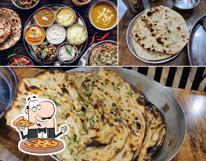 Try out pizza at Sharma Bhojnalya