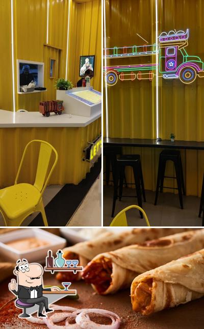This is the image showing interior and food at Roll Baby Roll